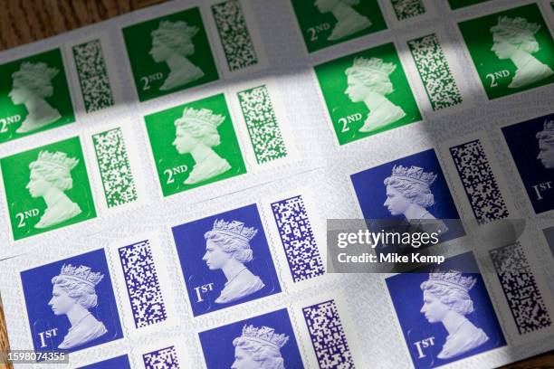 Books of barcoded Royal Mail 1st and 2nd class postage stamps depicting the head of Queen Elizabeth II on 29th July 2023 in St Dogmaels, Wales,...