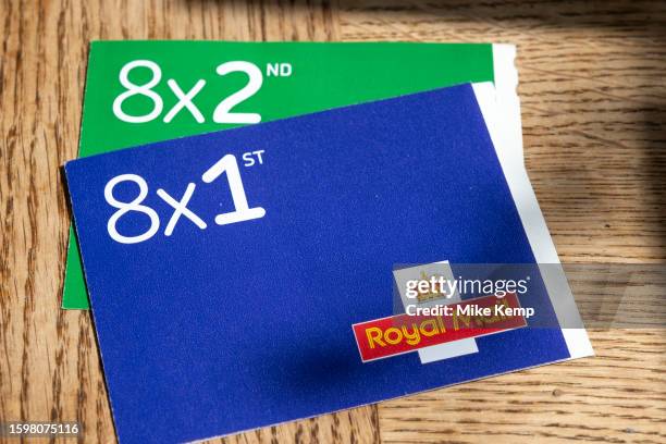 Books of barcoded Royal Mail 1st class postage stamps with the Royal Mail logo on 29th July 2023 in St Dogmaels, Wales, United Kingdom. Non barcoded...