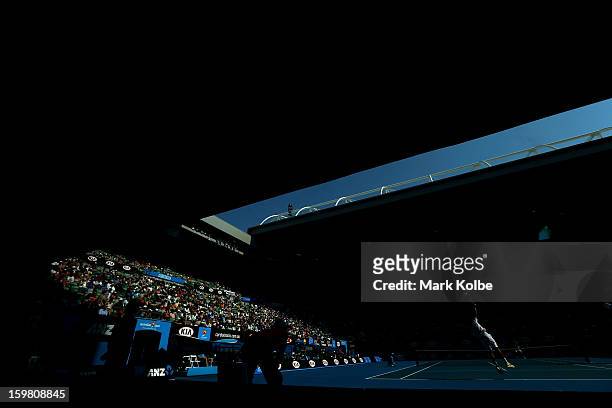 Jo-Wilfried Tsonga of France serves in his fourth round match against Richard Gasquet of France during day eight of the 2013 Australian Open at...