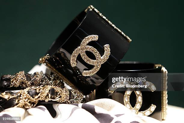 Chanel SA branded goods are displayed in the window of the store in the Ginza district of Tokyo, Japan, on Sunday, Jan. 20, 2013. Japan's consumer...