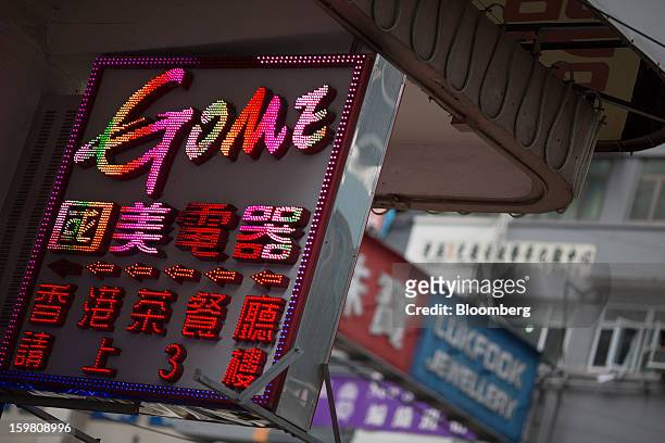 Signage for a Gome-branded store is displayed outside the store in the shopping district of Causeway Bay in Hong Kong, China, on Monday, Jan. 21,...