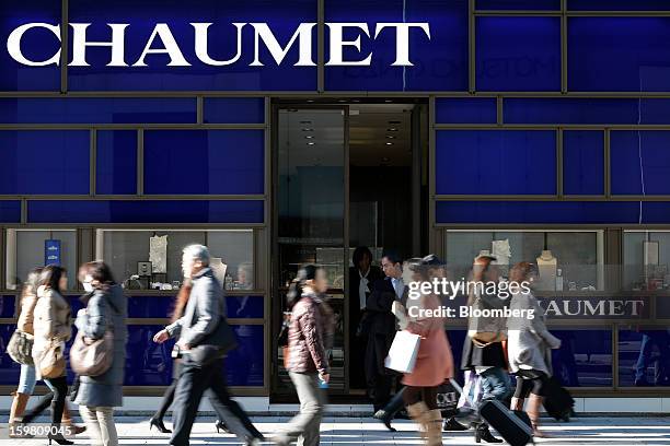 Pedestrians walk past a Chaumet store, a luxury unit of LVMH Moet Hennessy Louis Vuitton SA, in the Ginza district of Tokyo, Japan, on Sunday, Jan....