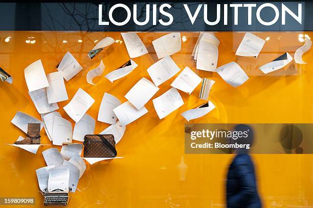 Pedestrian walks past a Louis Vuitton store, operated by LVMH Moet Hennessy Louis Vuitton SA, in the Ginza district of Tokyo, Japan, on Sunday, Jan....