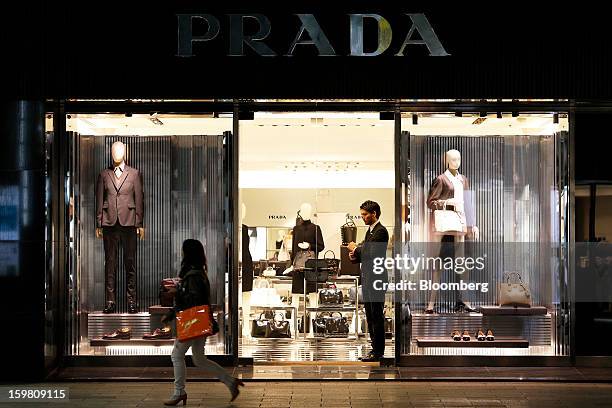 Pedestrian walks past a Prada SpA store in the Ginza district of Tokyo, Japan, on Sunday, Jan. 20, 2013. Japan's consumer prices excluding fresh...