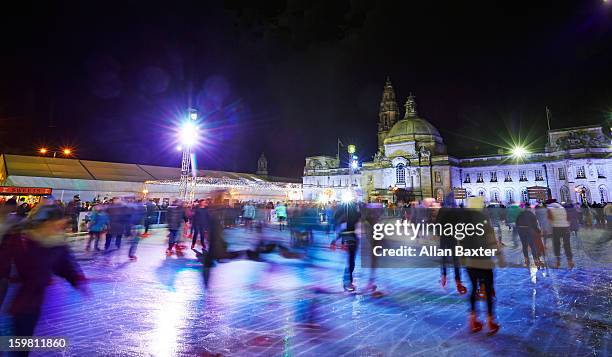 ice rink with cardiff city hall - eislaufen stock-fotos und bilder