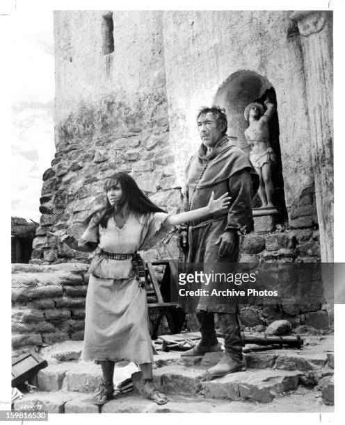 Anjanette Comer pleads for the life of Anthony Quinn who portrays a rebel preist in a scene from the film 'Guns for San Sebastian', 1968.