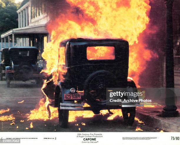 Car explodes in a scene from the film 'Capone', 1975.