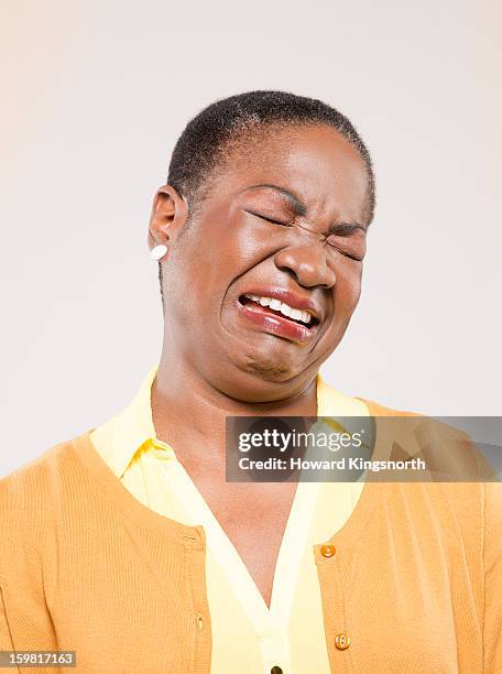 twisted faces - crying sad african woman stock pictures, royalty-free photos & images