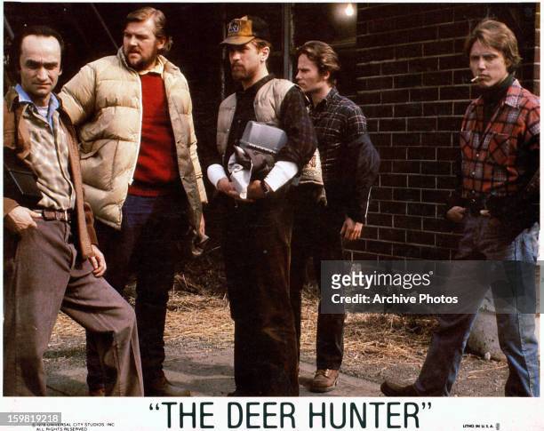 John Cazale, Chuck Aspegren, Robert De Niro, John Savage, and Christopher Walken standing together in a scene from the film 'The Deer Hunter', 1978.