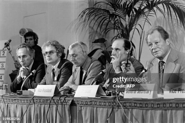 An archive photo taken on September 29, 1978 in Paris shows Israeli Labor Party leader Shimon Peres, French Honorary President Lionel Jospin, Robert...