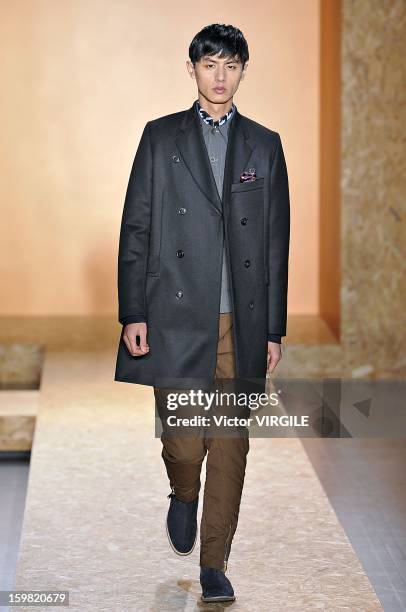 Model walks the runway during the Paul Smith Ready to Wear Fall/Winter 2013-2014 show as part of Paris Fashion Week on January 20, 2013 in Paris,...