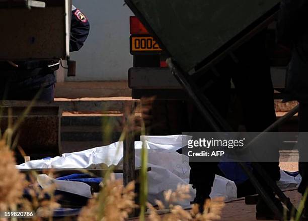 Body bags of victims that were killed during the hostage crisis at a desert gas plant in Algeria's deep south are seen after they were unloaded from...
