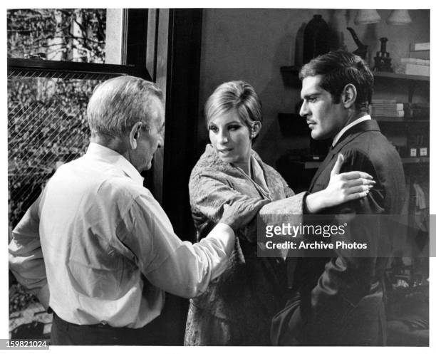 Director William Wyler rehearses scene with Barbra Streisand and Omar Sharif on the set of the film 'Funny Girl', 1968.