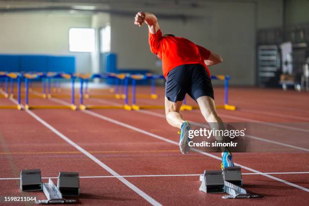 athlete taking off for sprint - sprinting stock pictures, royalty-free photos & images