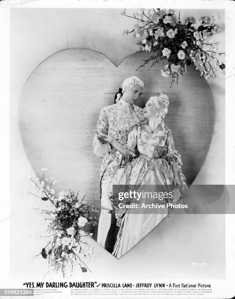 Jeffrey Lynn holding Priscilla Lane in movie art for the film 'Yes, My Darling Daughter', 1939.