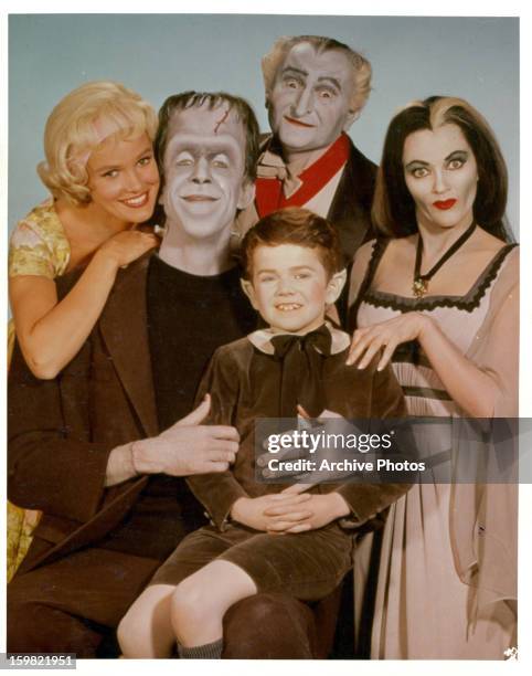 Pat Priest, Al Lewis and Butch Patrick along with Fred Gwynne and Yvonne De Carlo of the Munster family in a publicity photograph from the television...