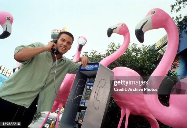 Ben Affleck talks on a payphone in a scene from the film 'Forces Of Nature', 1999.