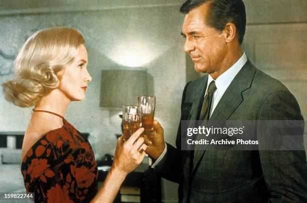 Eva Marie Saint toasts Cary Grant in a scene from the film 'North By Northwest', 1959.