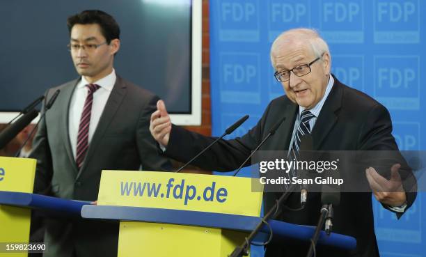 Philipp Roesler , Chairman of the German Free Democrats , and FDP Bundestag faction leader Rainer Bruederle speak to the media to confirm their...