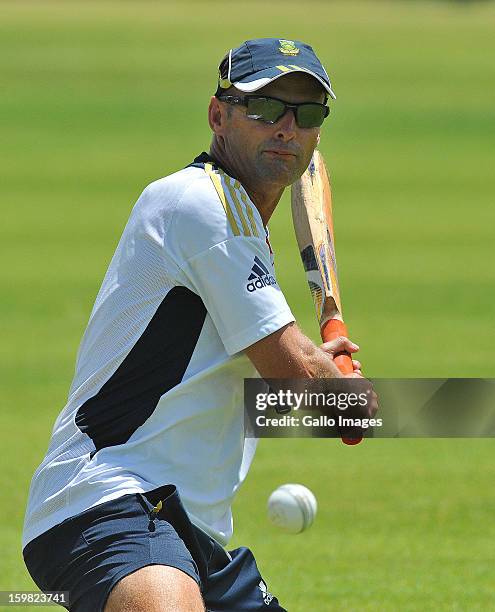 Gary Kirsten bats for the slips during the South African national cricket team nets session and press conference at De Beers Diamond Oval on January...