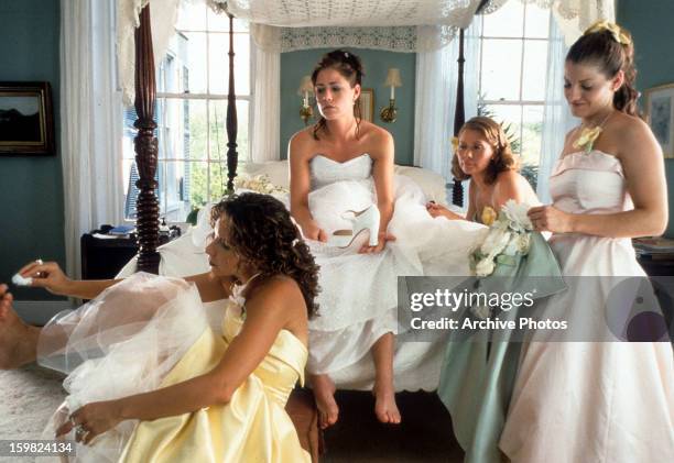 Maura Tierney and her bridesmaids get ready for her wedding in a scene from the film 'Forces Of Nature', 1999.