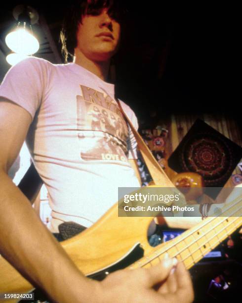 Giuseppe Andrews playing the guitar in a scene from the film 'Detroit Rock City', 1999.