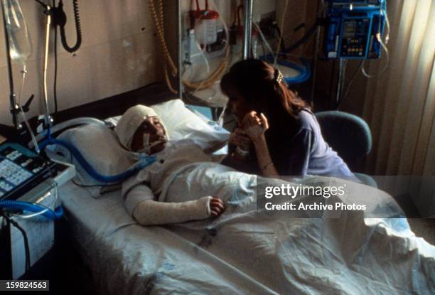 Lesley Ann Warren at the bedside of her daughter in a scene from the television movie 'Desperate Justice', 1993.