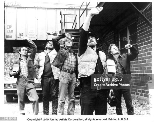 John Cazale, Chuck Aspegren, Christopher Walken Robert De Niro, John Savage looking up into the sky in a scene from the film 'The Deer Hunter', 1978.