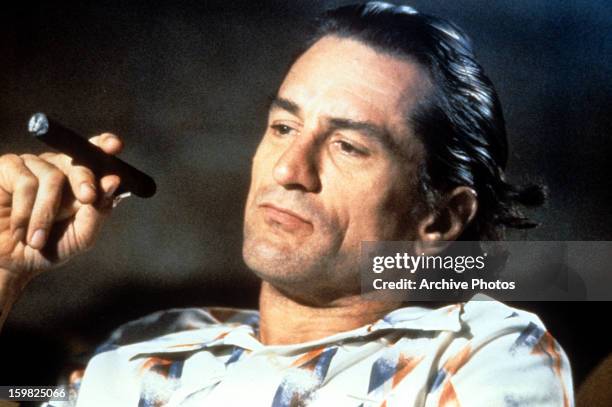 Robert De Niro smokes a cigar in a scene from the film 'Cape Fear', 1991.