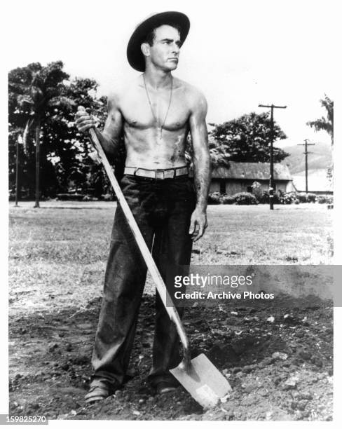 Montgomery Clift holds a shovel in a scene from the film 'From Here To Eternity', 1953.