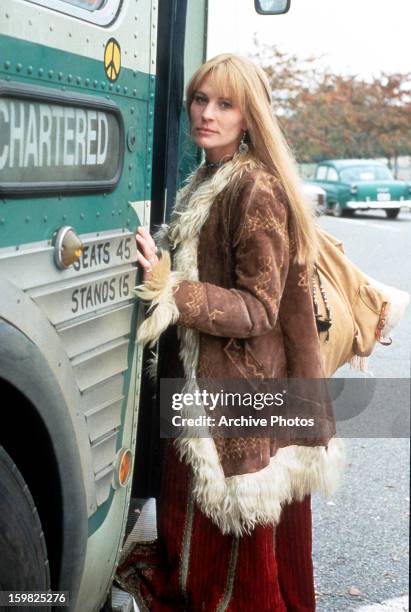 Robin Wright boards a bus in a scene from the film 'Forrest Gump', 1994.