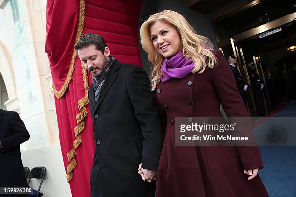 Singer Kelly Clarkson and Brandon Blackstock arrive at the presidential inauguration on the West Front of the U.S. Capitol January 21, 2013 in...