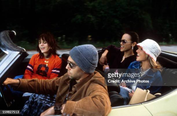 Taryn Manning, Anson Mount, Zoe Saldana, and Britney Spears driving in car in a scene from the film 'Crossroads', 2002.