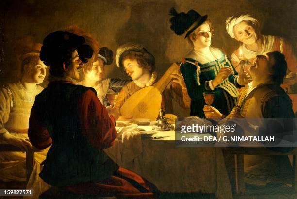 Feast with a lute player, ca 1620, by Gerrit van Honthorst , oil on canvas. 17th century. Florence, Galleria Degli Uffizi