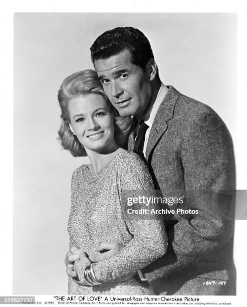 Angie Dickinson is held by James Garner in publicity portrait for the film 'The Art Of Love', 1965.