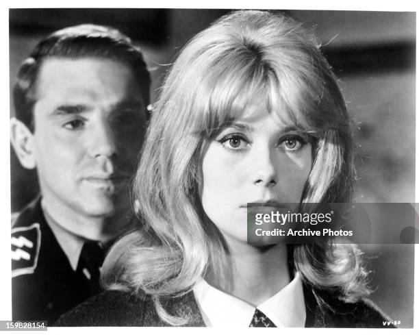 Annette Vadim with SS guard behind her in a scene from the film 'Agent Of Doom', 1963.