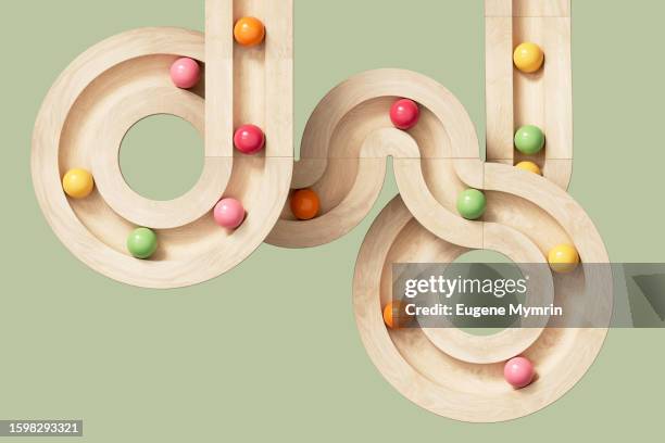 3d image of rolling spheres along a path. creativity, learning, collaboration and teamwork concept. - esfuerzo fotografías e imágenes de stock