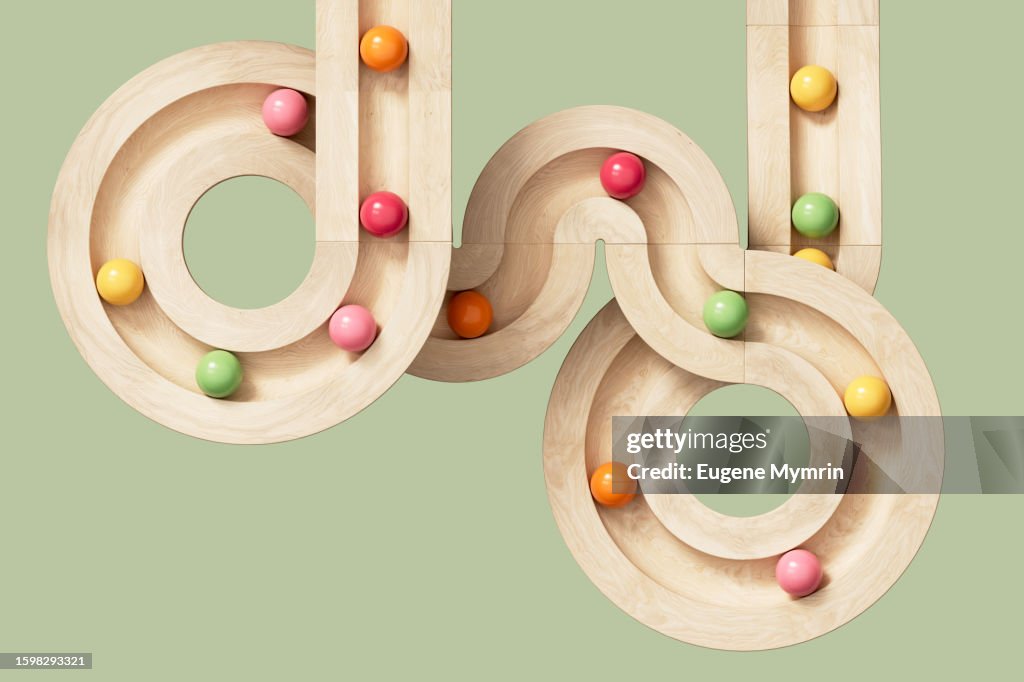 3D image of rolling spheres along a path. Creativity, learning, collaboration and teamwork concept.