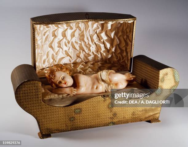 Music box with automaton of a sleeping child, wax. Italy, 20th century. Savio, Museo Di Strumenti Musicali Meccanici Marino Marini