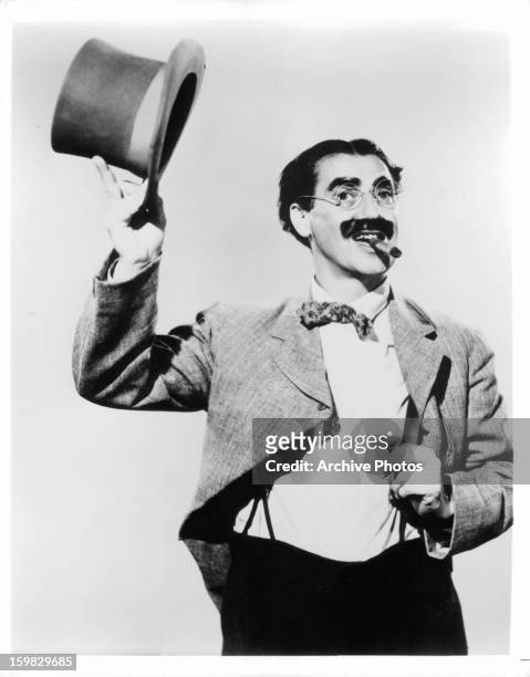 Groucho Marx tips his hat in publicity portrait for the film 'Room Service', 1938.