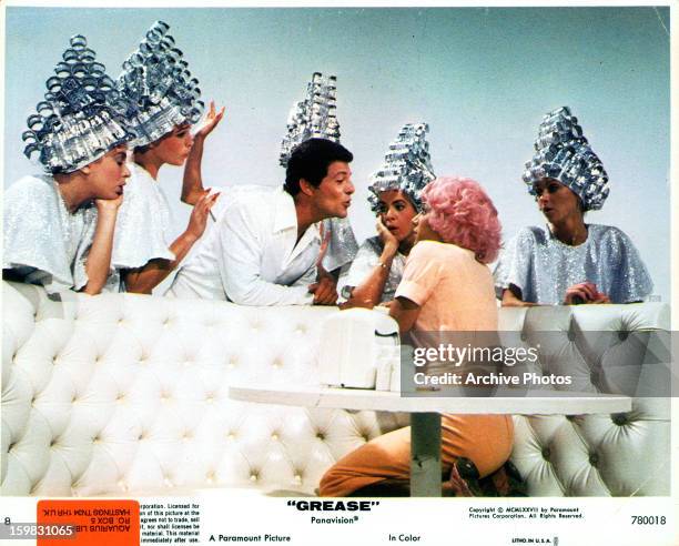 Frankie Avalon and Stockard Channing serenade Didi Conn in a scene from the film 'Grease', 1978.