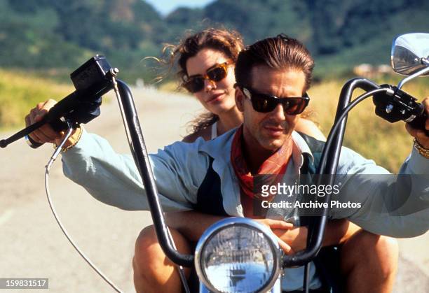 Carré Otis rides with Mickey Rourke in a scene from the film 'Wild Orchid', 1989.