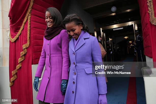 Malia Obama and Sasha Obama arrive during the presidential inauguration on the West Front of the U.S. Capitol January 21, 2013 in Washington, DC....