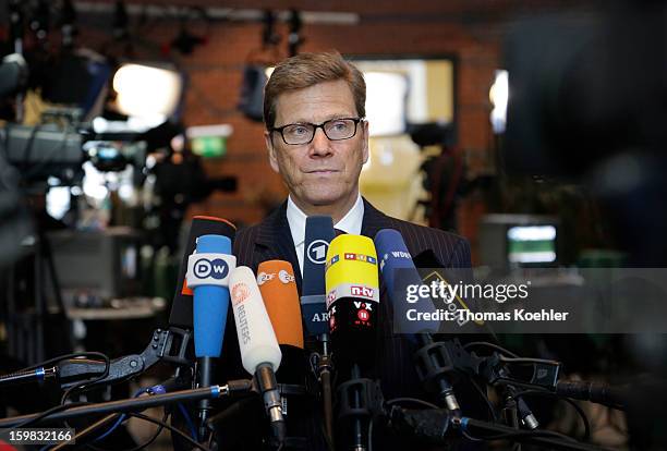 German Foreign Minister Guido Westerwelle speeks to the press a day after the SPD and German Greens party emerged with a hairline victory in Lower...