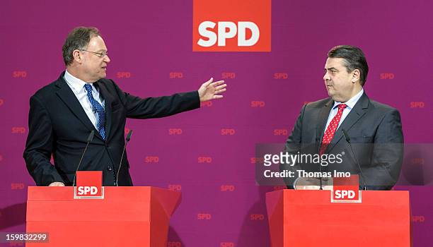 Stephan Weil, candidate in Lower Saxony for the German Social Democrats , and SPD Chairman Sigmar Gabriel speak to the media during a press...