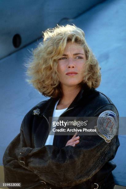 Kelly McGillis folds her arms in a scene from the film 'Top Gun', 1986.