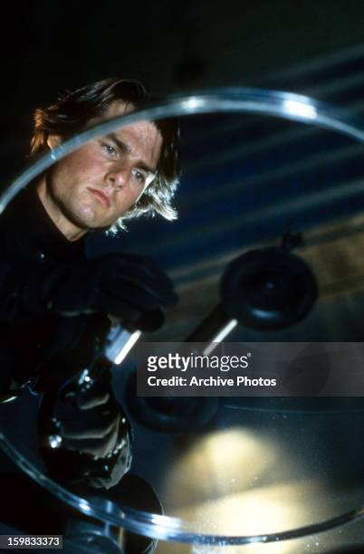 Tom Cruise on a mission in a scene from the film 'Mission: Impossible II', 2000.