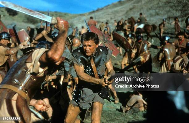 Kirk Douglas the slave Spartacus, engaged in battle in a scene from the film 'Spartacus', 1960.