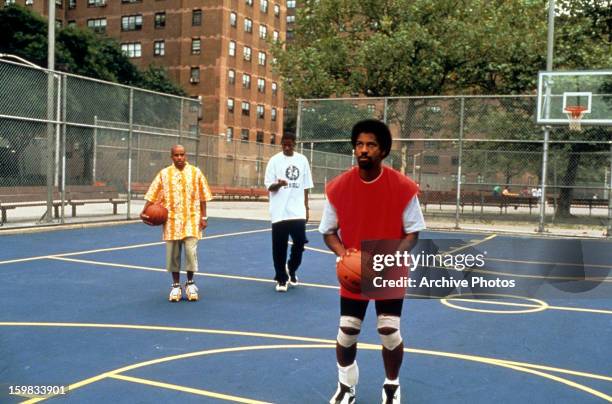Denzel Washington shoots hoops in a scene from the film 'He Got Game', 1998.