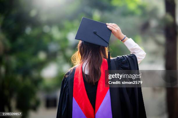 happy asian woman in his graduation day - graduation excitement stock pictures, royalty-free photos & images